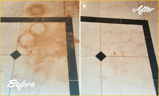 Before and After Picture of a Jeffersonville Hard Surface Restoration Service on a Marble Floor to Eliminate Rust Stains